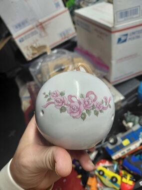 vintage white ceramic or porcelain pomander ball designed to hold potpourri